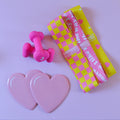 3 hip Resistance bands, a set of heart shaped sliding disks, a set of 3 pound dumbbells