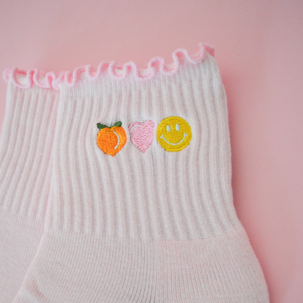 shine society fit shop peach heart and happy face grip sock in light pink
