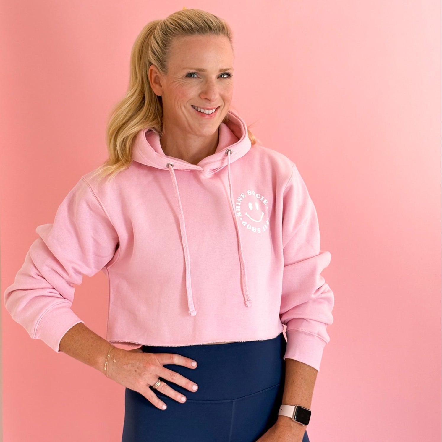Crop pink sweatshirt with happy face logo