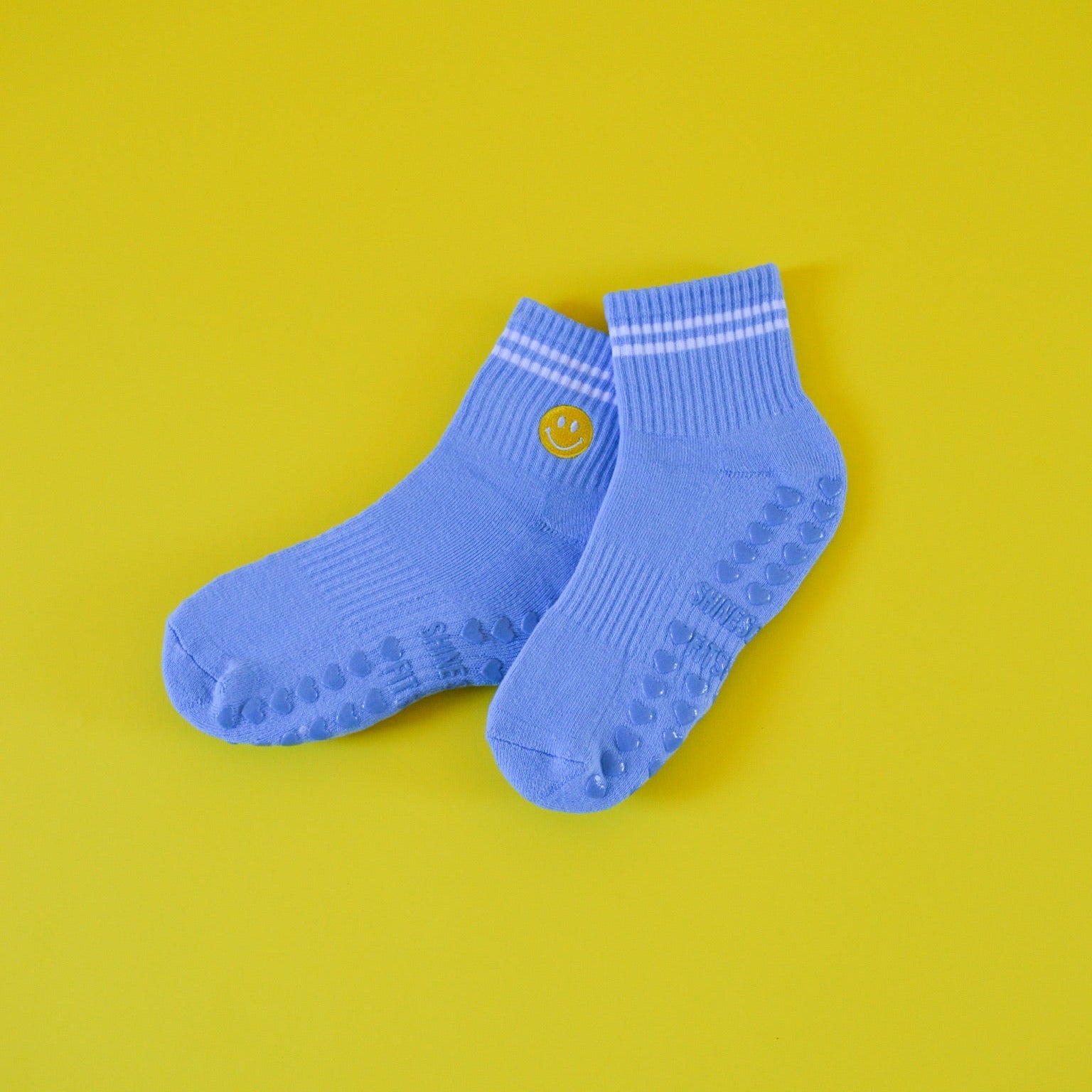 Blue socks with a yellow smiley face