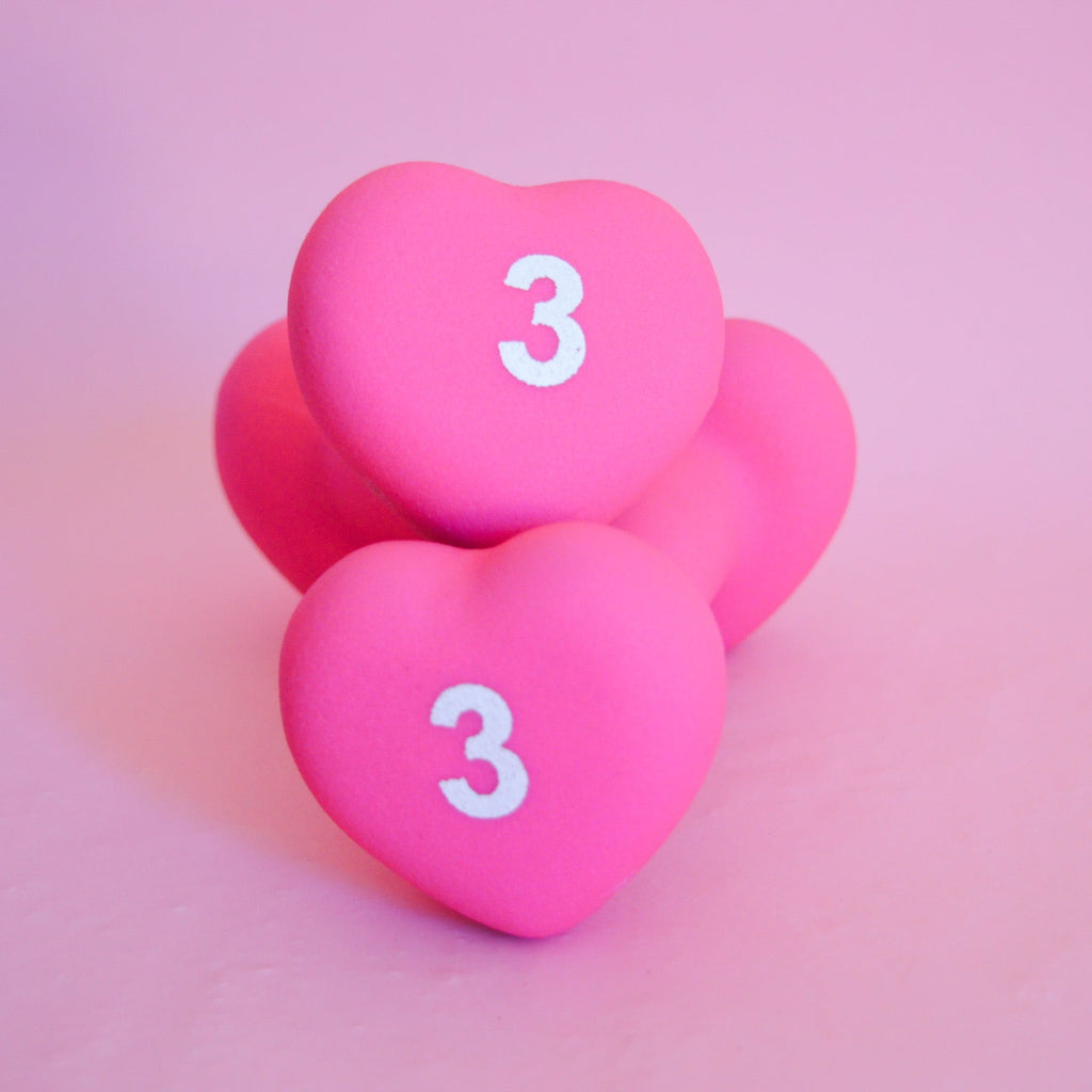 2 pink heart-shaped 3 pound weights 