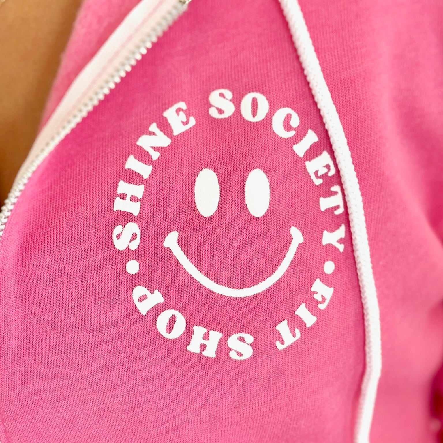 Happy Face 'Shine Society Fit Shop' logo